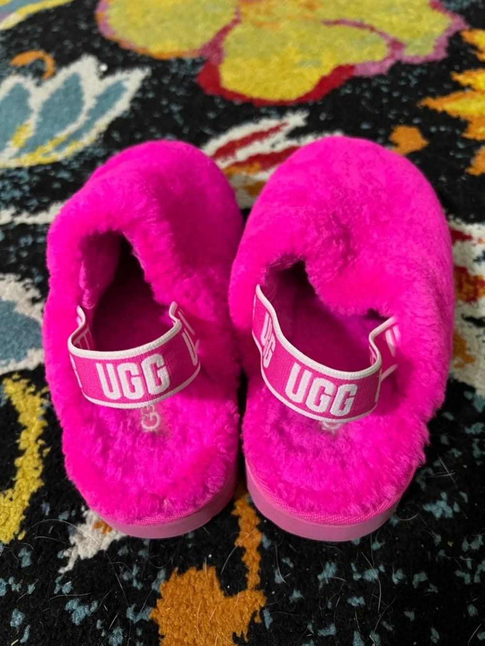 Pink fuzzy Ugg kids slip on